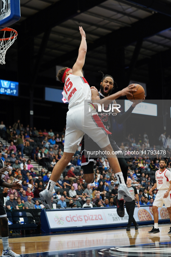 Phil Wheeler, #23 of the Texas Legends, drives to the basket against Race Thompson, #15 of the Memphis Hustle, during the NBA G League regul...