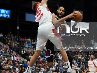 Phil Wheeler, #23 of the Texas Legends, drives to the basket against Race Thompson, #15 of the Memphis Hustle, during the NBA G League regul...