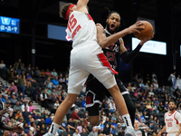 Phil Wheeler, #23 of the Texas Legends, drives to the basket against Race Thompson, #15 of the Memphis Hustle, during the NBA G League regul...