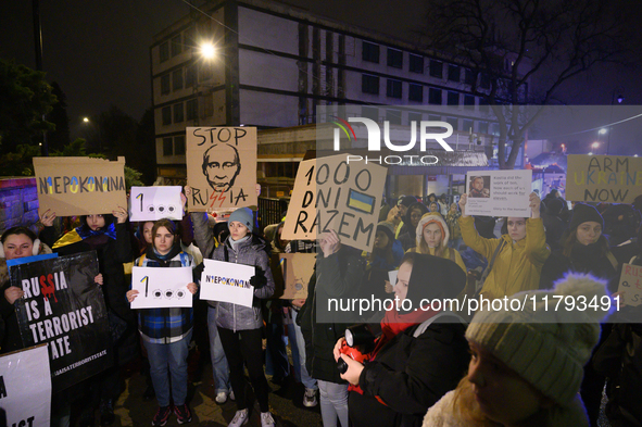 People hold placards and signs that read ''Stop Russia,'' ''Unbeatables,'' and ''A 1000 days together'' as they rally on the 1000th day of R...