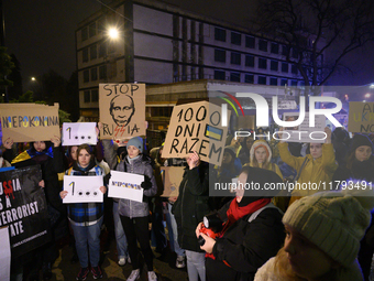 People hold placards and signs that read ''Stop Russia,'' ''Unbeatables,'' and ''A 1000 days together'' as they rally on the 1000th day of R...