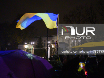 Demonstrators wave Ukrainian flags outside the Russian Federation embassy as they rally on the 1000th day of Russian aggression on Ukraine i...