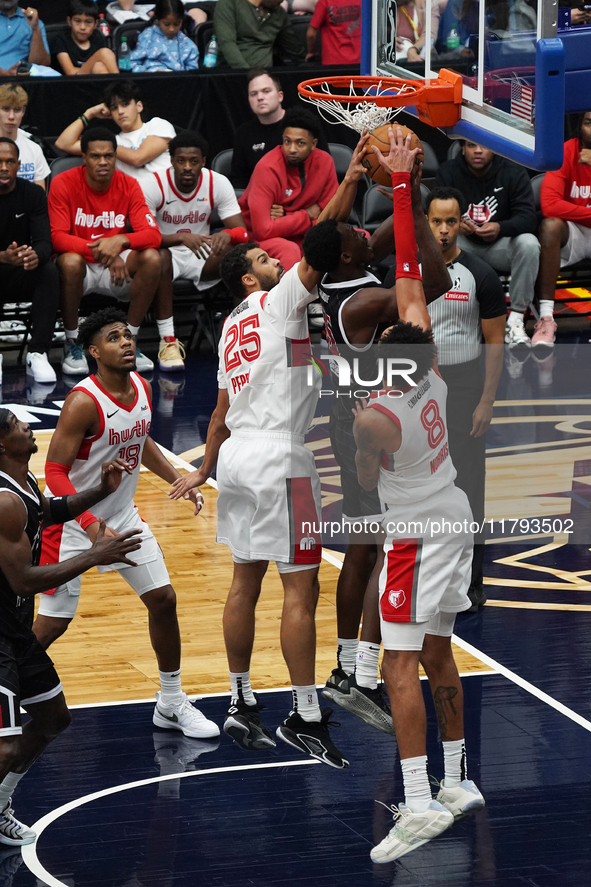 Maozinha Pereira #25 and Miles Norris #8 of the Memphis Hustle block Warith Alatishe #55 of the Texas Legends' shot during the NBA G League...