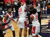 Maozinha Pereira #25 and Miles Norris #8 of the Memphis Hustle block Warith Alatishe #55 of the Texas Legends' shot during the NBA G League...