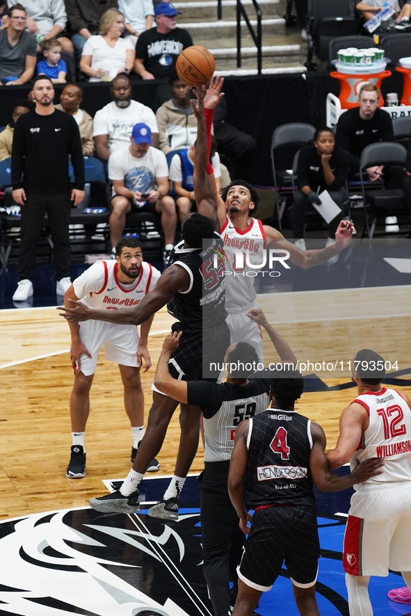 Miles Norris #8 of Memphis Hustle and Warith Alatishe #55 of Texas Legends jump for the tip-off during the NBA G League regular season match...