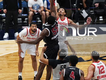 Miles Norris #8 of Memphis Hustle and Warith Alatishe #55 of Texas Legends jump for the tip-off during the NBA G League regular season match...