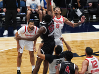 Miles Norris #8 of Memphis Hustle and Warith Alatishe #55 of Texas Legends jump for the tip-off during the NBA G League regular season match...