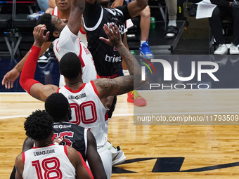 Tyson Walker #14 of Texas Legends shoots the ball against Memphis Hustle during the NBA G League regular season match at Comerica Center in...