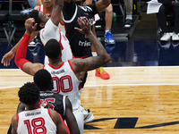 Tyson Walker #14 of Texas Legends shoots the ball against Memphis Hustle during the NBA G League regular season match at Comerica Center in...