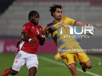 In Ta' Qali, Malta, on November 19, 2024, Joan Cervos of Andorra is closely followed by Joseph Mbong of Malta during the UEFA Nations League...