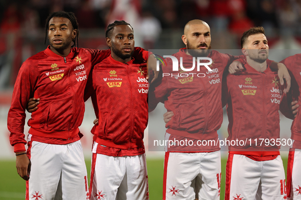 In Ta' Qali, Malta, on November 19, 2024, Malta soccer national team players stand during the playing of their country's national anthem pri...