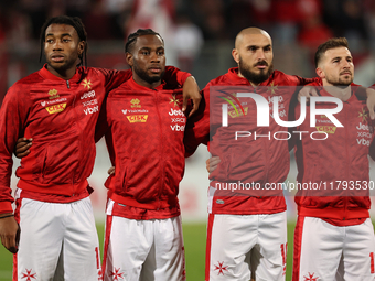 In Ta' Qali, Malta, on November 19, 2024, Malta soccer national team players stand during the playing of their country's national anthem pri...