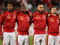 In Ta' Qali, Malta, on November 19, 2024, Malta soccer national team players stand during the playing of their country's national anthem pri...