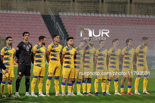 In Ta' Qali, Malta, on November 19, 2024, Andorra soccer national team players stand during the playing of their country's national anthem p...