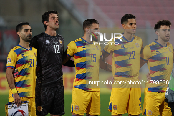 In Ta' Qali, Malta, on November 19, 2024, Andorra soccer national team players stand during the playing of their country's national anthem p...