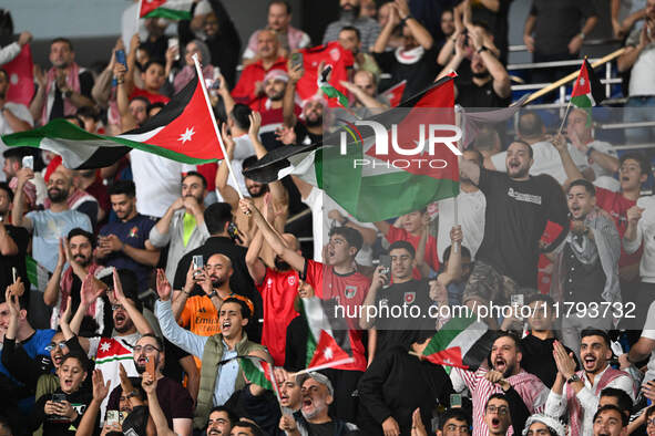 Soccer fans cheer during the AFC Asian Qualifiers Road to 26 match between Kuwait and Jordan in Kuwait City, Kuwait, on November 19, 2024, a...