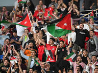 Soccer fans cheer during the AFC Asian Qualifiers Road to 26 match between Kuwait and Jordan in Kuwait City, Kuwait, on November 19, 2024, a...