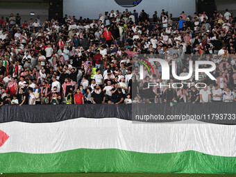 Soccer fans cheers during the AFC Asian Qualifiers Road to 26 match between Kuwait and Jordan in Kuwait City, Kuwait, on 19 November 2024, a...