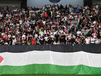 Soccer fans cheers during the AFC Asian Qualifiers Road to 26 match between Kuwait and Jordan in Kuwait City, Kuwait, on 19 November 2024, a...