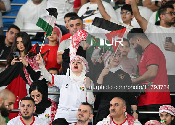 Soccer fans cheer during the AFC Asian Qualifiers Road to 26 match between Kuwait and Jordan in Kuwait City, Kuwait, on November 19, 2024, a...