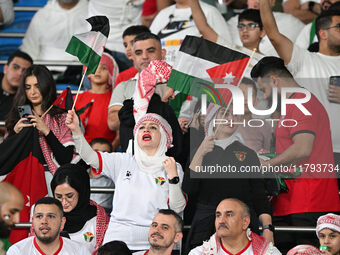 Soccer fans cheer during the AFC Asian Qualifiers Road to 26 match between Kuwait and Jordan in Kuwait City, Kuwait, on November 19, 2024, a...