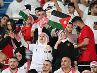 Soccer fans cheer during the AFC Asian Qualifiers Road to 26 match between Kuwait and Jordan in Kuwait City, Kuwait, on November 19, 2024, a...