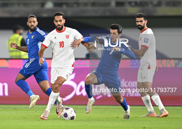 Mohammad Abdullah of Kuwait competes against Mousa Altamari of Jordan during the AFC Asian Qualifiers Road to 26 match between Kuwait and Jo...