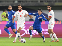 Mohammad Abdullah of Kuwait competes against Mousa Altamari of Jordan during the AFC Asian Qualifiers Road to 26 match between Kuwait and Jo...