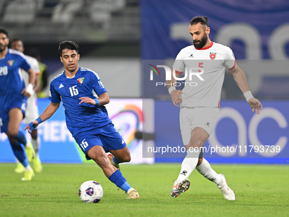 Yosef Alshammari of Kuwait competes against Yazan Alarab of Jordan during the AFC Asian Qualifiers Road to 26 match between Kuwait and Jorda...