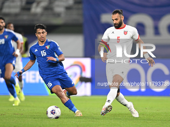 Yosef Alshammari of Kuwait competes against Yazan Alarab of Jordan during the AFC Asian Qualifiers Road to 26 match between Kuwait and Jorda...