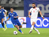 Yosef Alshammari of Kuwait competes against Yazan Alarab of Jordan during the AFC Asian Qualifiers Road to 26 match between Kuwait and Jorda...