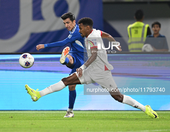 Mohammad Abdullah of Kuwait competes against Abdallah Nasib of Jordan during the AFC Asian Qualifiers Road to 26 match between Kuwait and Jo...