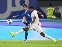 Mohammad Abdullah of Kuwait competes against Abdallah Nasib of Jordan during the AFC Asian Qualifiers Road to 26 match between Kuwait and Jo...