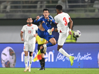 Mohammad Abdullah of Kuwait competes against Abdallah Nasib of Jordan during the AFC Asian Qualifiers Road to 26 match between Kuwait and Jo...