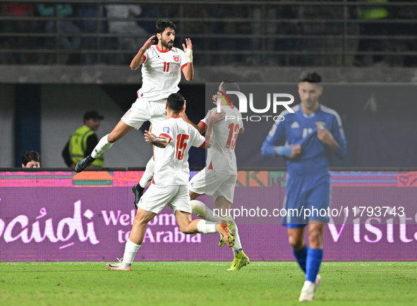 Yazan Alnaimat of Jordan celebrates with teammates after scoring a goal during the AFC Asian Qualifiers Road to 26 match between Kuwait and...