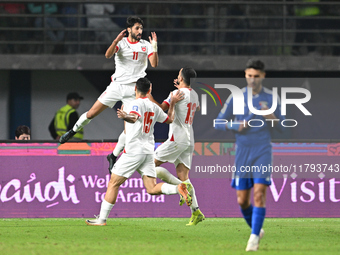 Yazan Alnaimat of Jordan celebrates with teammates after scoring a goal during the AFC Asian Qualifiers Road to 26 match between Kuwait and...