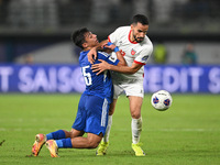 Yosef Alshammari of Kuwait competes against Mahmoud Almardi of Jordan during the AFC Asian Qualifiers Road to 26 match between Kuwait and Jo...