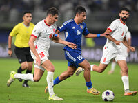 Yosef Alshammari of Kuwait competes against Mohammad Abualnadi of Jordan during the AFC Asian Qualifiers Road to 26 match between Kuwait and...