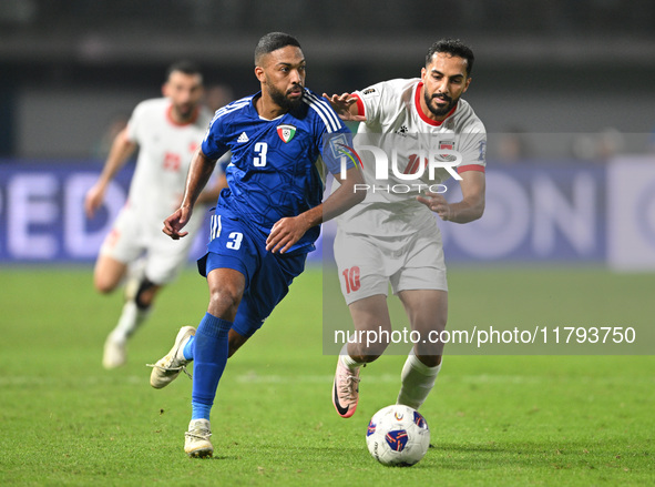 Meshari Alenezi of Kuwait competes against Mousa Altamari of Jordan during the AFC Asian Qualifiers Road to 26 match between Kuwait and Jord...