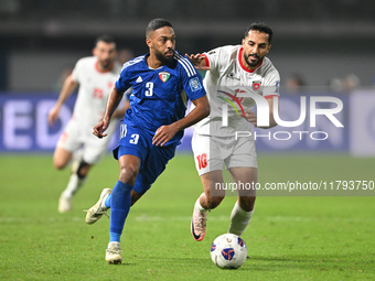 Meshari Alenezi of Kuwait competes against Mousa Altamari of Jordan during the AFC Asian Qualifiers Road to 26 match between Kuwait and Jord...