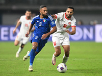 Meshari Alenezi of Kuwait competes against Mousa Altamari of Jordan during the AFC Asian Qualifiers Road to 26 match between Kuwait and Jord...