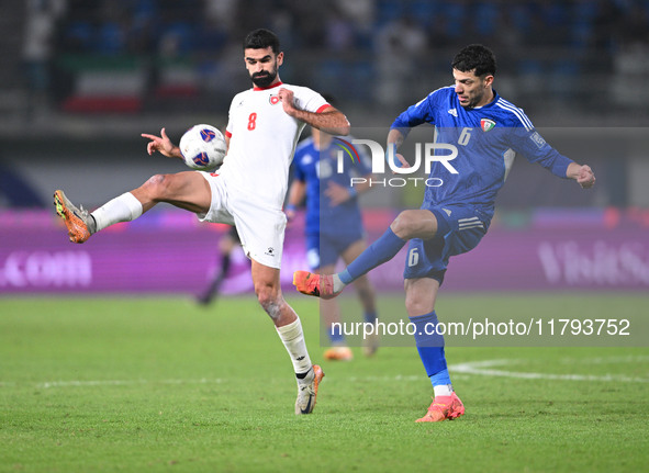 Sultan Alenezi of Kuwait competes against Nizar Alrashdan of Jordan during the AFC Asian Qualifiers Road to 26 match between Kuwait and Jord...