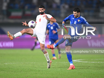 Sultan Alenezi of Kuwait competes against Nizar Alrashdan of Jordan during the AFC Asian Qualifiers Road to 26 match between Kuwait and Jord...