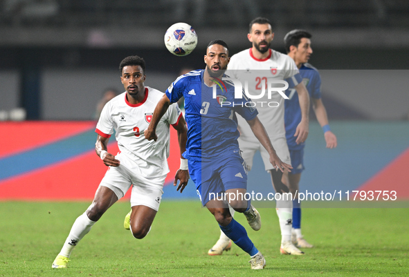 Meshari Alenezi of Kuwait competes against Abdallah Nasib of Jordan during the AFC Asian Qualifiers Road to 26 match between Kuwait and Jord...