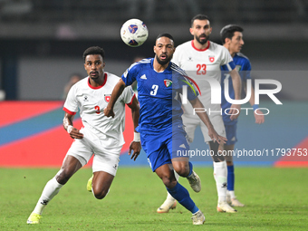 Meshari Alenezi of Kuwait competes against Abdallah Nasib of Jordan during the AFC Asian Qualifiers Road to 26 match between Kuwait and Jord...