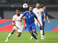 Meshari Alenezi of Kuwait competes against Abdallah Nasib of Jordan during the AFC Asian Qualifiers Road to 26 match between Kuwait and Jord...