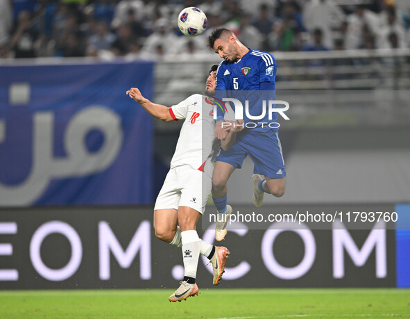 Fahad Alhajeri of Kuwait competes against Resin Mohammed Banihani of Jordan during the AFC Asian Qualifiers Road to 26 match between Kuwait...