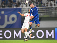 Fahad Alhajeri of Kuwait competes against Resin Mohammed Banihani of Jordan during the AFC Asian Qualifiers Road to 26 match between Kuwait...