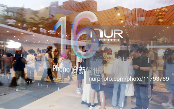 Customers shop at the largest Apple flagship store in Asia in Shanghai, China, on September 22, 2024. 