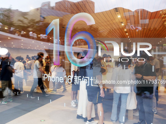 Customers shop at the largest Apple flagship store in Asia in Shanghai, China, on September 22, 2024. (